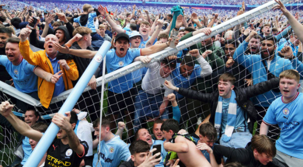 Man City clinch title from Liverpool after late goal flurry